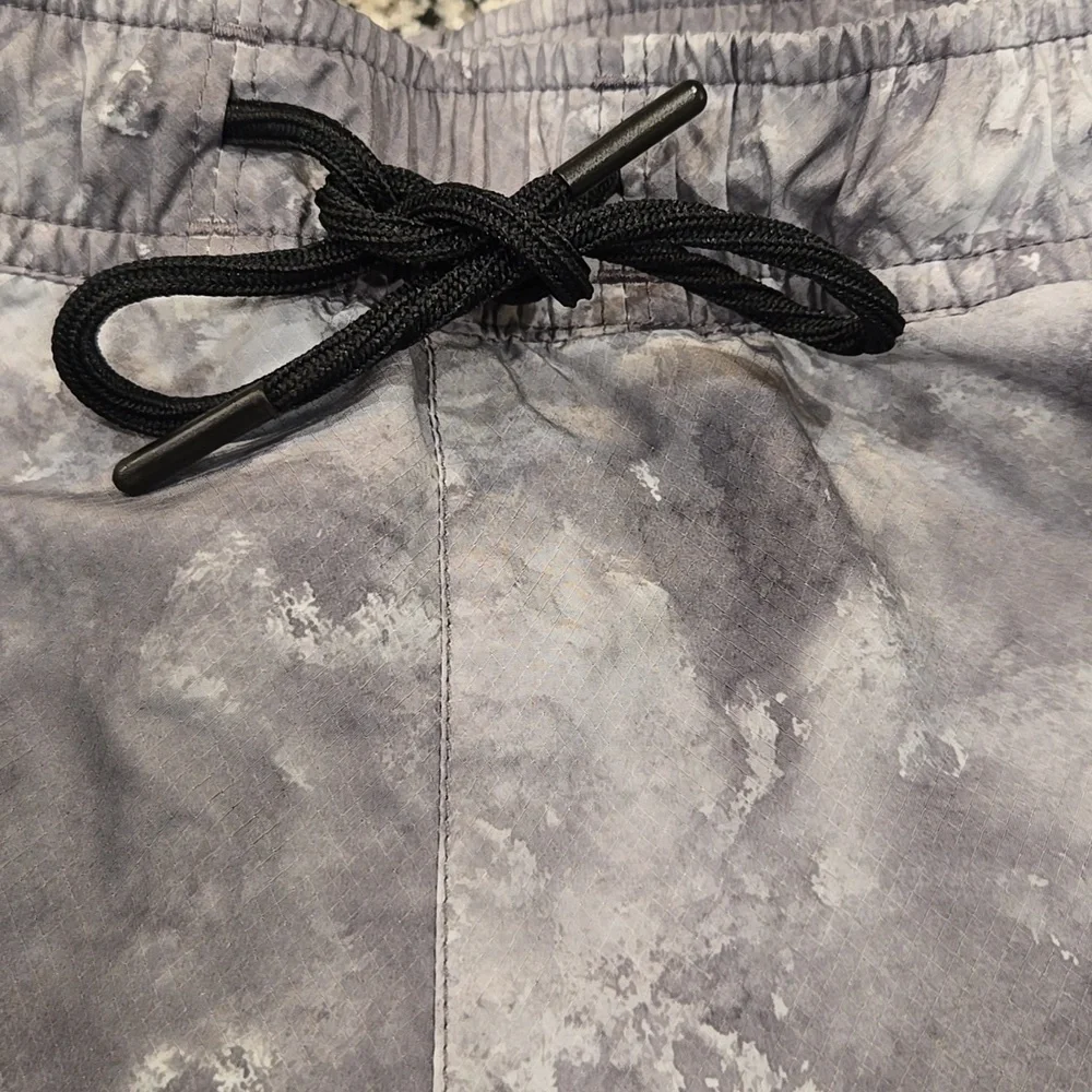 HERSCHEL SUPPLY CO. GREY SWIM TRUNKS. SIZE MEDIUM . 33-36 INCHES.